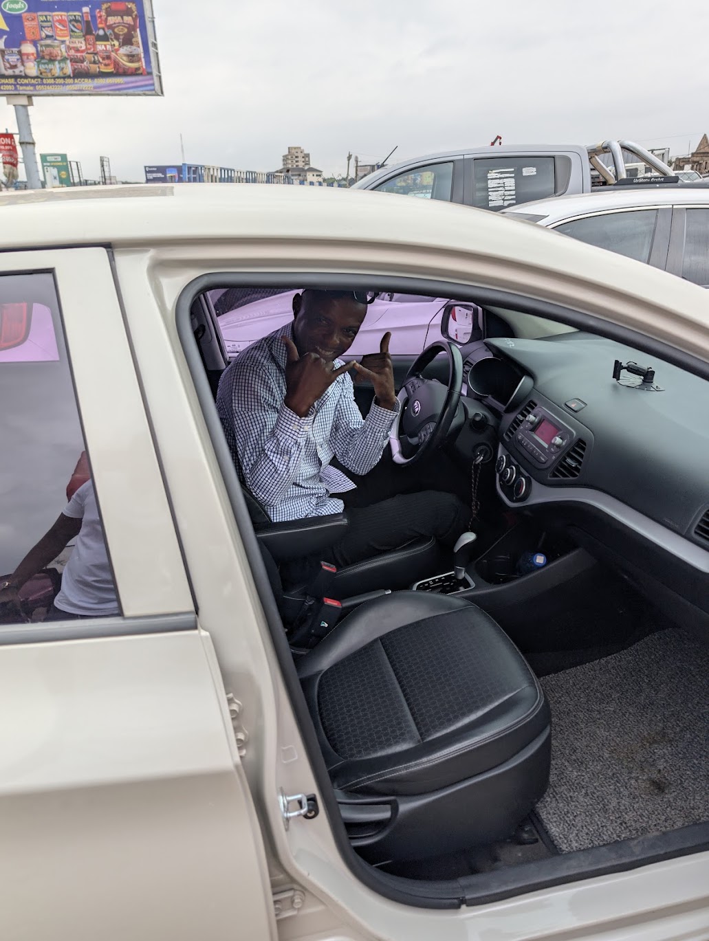 A man seated at the wheel of the car during the handover